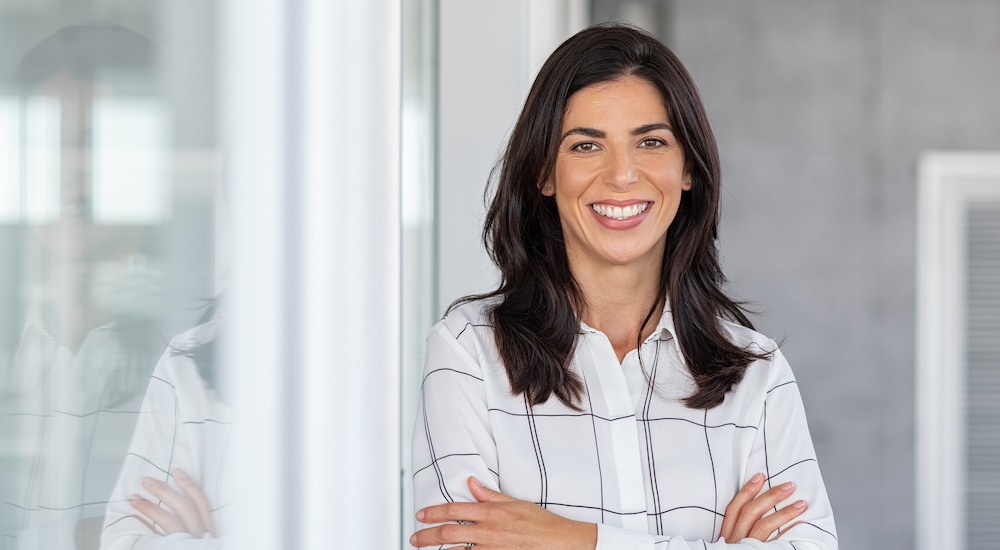 Successful mature business woman looking at camera individual-insurance